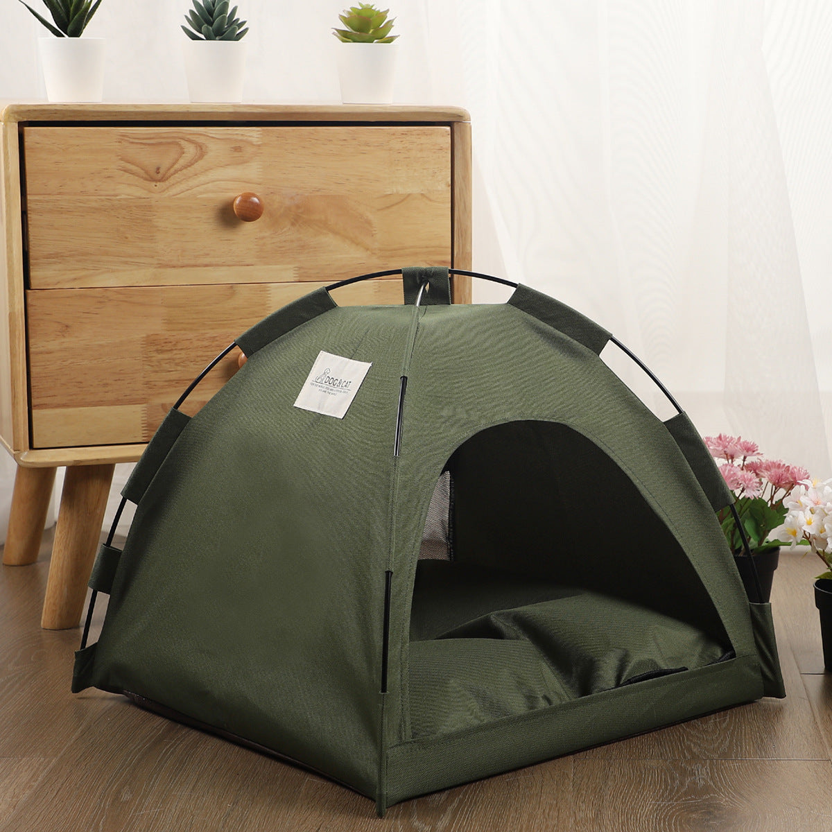 PawCare™ Pet Tent Bed in military green, cozy cooling hideaway for dogs and cats, with soft fabric and enclosed design.