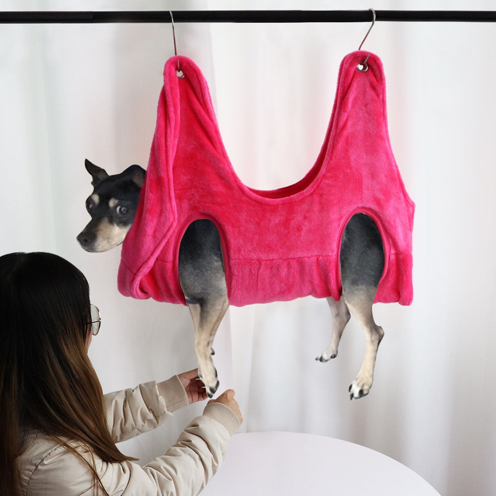 Pink PawCare™ grooming hammock for pets, provides stress-free nail care support with a soft, supportive design for safe, comfortable grooming.