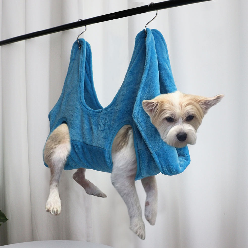 PawCare™ pink pet grooming hammock supporting stress-free nail care for dogs and cats during grooming sessions.